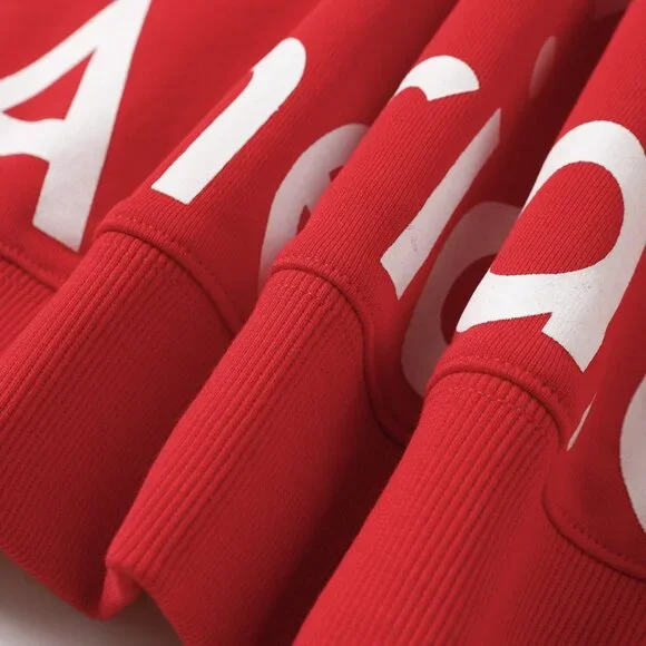 Red lettering Denim Tears zip-up hooded jacket